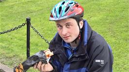 Tao enjoying his ... pizza? .. outside Wells Cathedral